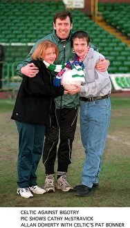 Pat Bonner Prints: Pat Bonner with Cathy McStravick and Allan Doherty on football pitch green white scarf