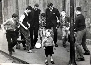 Pat Crerand with kids in the street 1960 pat Crerand on left football children
