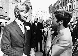 Patricia McCallum Photographer taking pictures of her new husband Michael York outside