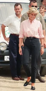 Paul Burrell (left, in the background in the white shirt and black trousers