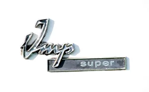 Paul Coulter with his restored Hillman Imp April 1998 Imp super badge