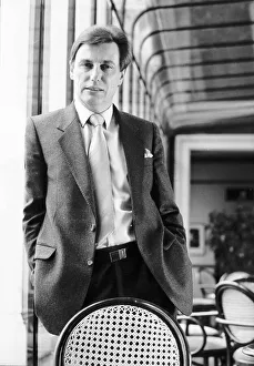 00148 Prints: Paul Darrow actor - April 1985 Standing behind a chair at the Grand Theatre in