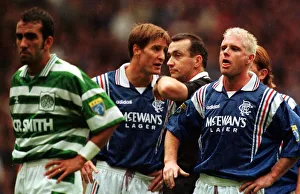 Gazza Prints: Paul Gascoigne of Rangers makes a face at Paolo di Canio of Celtic with Richard Gough