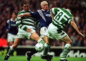 Paul Gascoigne of Rangers is tackled by Peter Grant of Celtic in the Scottish Premier
