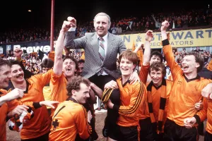 Paul Hegarty and Richard Gough give their manager a lift as they hold up Dundee United