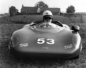 Crash Helmets Prints: Paul Johnstone, 13, sets off in his 60mph midget sports car for a spin round the track