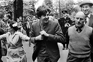 00437 Prints: Paul McCartney of The Beatles is escorted past waiting fans as he arrives at ABC Studios