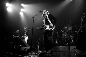 Paul McCartney, formerly of The Beatles, singing with Denny Laine of their new group