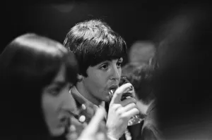 Paul McCartney enjoying a drink of wine as he attends the Ready Steady Go Rediffusion
