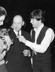 Paul McCartney with father Jim McCartney and actress Magda Konopka