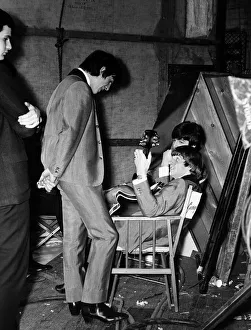 Paul McCartney, George Harrison and Ringo Starr of the Beatles backstage of The Scala