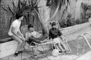 Paul McCartney, George Harrison and Ringo Starr relax on sun loungers at their rented