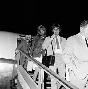 Paul McCartney and girlfriend Jane Asher return to London Airport after a holiday in