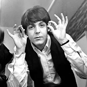 Paul McCartney with glass eyes when the Beatles details were being taken for their
