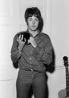 Paul McCartney holding a kittenat his home on his 25th birthday. 18 June 1967