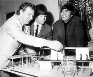 Paul McCartney and John Lennon of The Beatles with producer Johnny Hamp