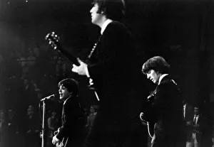 00587 Prints: Paul McCartney, John Lennon and George Harrison of The Beatles on stage at the Palais des