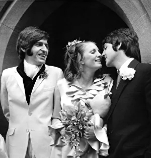 Kiss Prints: Paul McCartney kisses his new sister in law Angela Fishwick who married his brother Mike