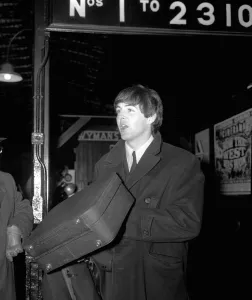 Paul McCartney at Paddington Station about to board the train for the filmining for