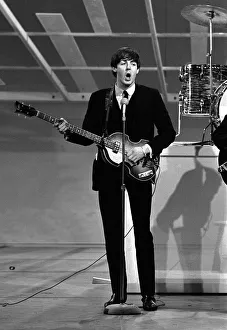 Core08 Prints: Paul McCartney playing guitar in New York during the Beatles first tour of America
