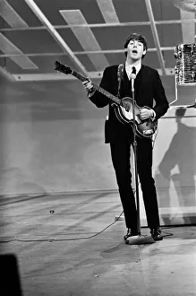 Paul McCartney playing guitar in New York during the Beatles first tour of America