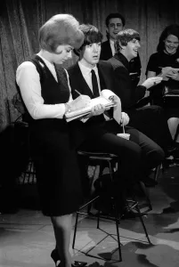 00084 Prints: Paul McCartney talking to a reporter in New York during the Beatles first tour of