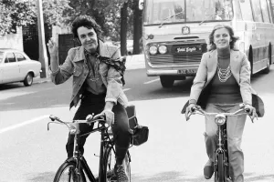 Cycling Prints: Paul McCartney and wife Linda McCartney riding bicycles in London