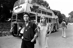 01476 Prints: Paul McCartney and his wife Linda in Paris, France, with other members of the group Wings