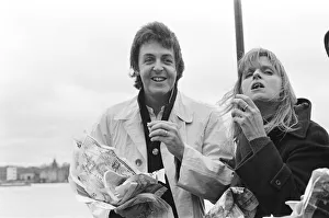 River Prints: Paul McCartney and his wife Linda of pop group Wings sailing down the River Thames