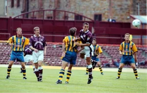 Paul Ritchie Hearts football player heads clear during friendly with Southampton