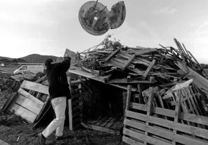 Paul Roberts of Abergele Round Table building a bonfire. 9th November 1995