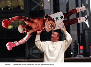 Paul Weir boxer holds cardboard cut out of Baby Jake Matlala who he will fight in a
