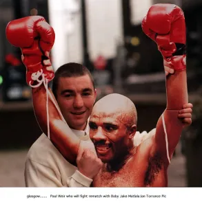 Paul Weir holds cardboard cut out Baby Jake Matlala who he will fight in rematch WBO