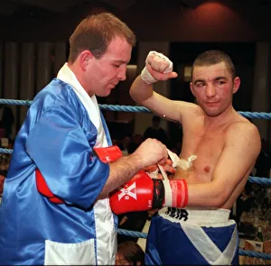 Paul Weir taking gloves off after losing fight 1998 against Alfonso Zvenyika
