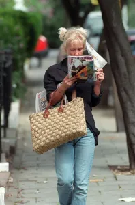 Paula Yates TV Presenter August 1998 Walking down the street reading a magazine