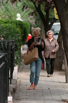 Paula Yates TV Presenter August 1998 Walking down the street reading a magazine not