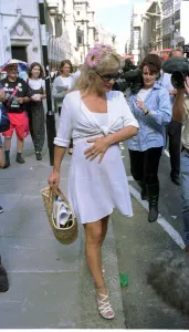 Paula yates tv presenter leaving the high court with ex husband bob geldof singer after