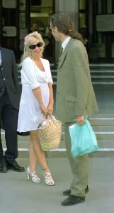 Paula yates tv presenter leaving the high court with ex husband bob geldof singer after