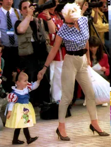 Paula Yates TV Presenter and Model with daughter at Eurodisney