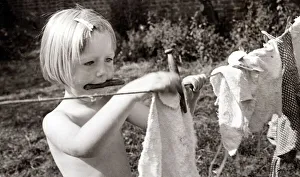 Laundry Prints: Pauline Carey aged 2 and a half hanging out the laundry to dry at the Hampstead (London