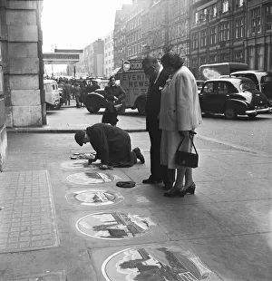 Pavement artist at work at Victoria Station, London, 21st May 1954
