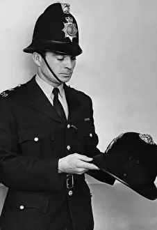 Equipment Prints: PC John Soanes wearing the new helmets which have been issued to officers in Essex