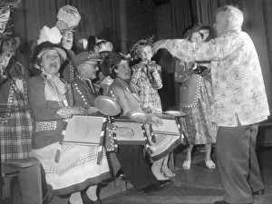 Musicians Prints: Pearly kings and queens play the washboard and other musical instruments during a concert