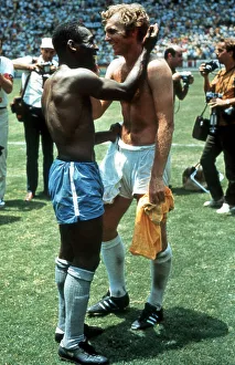Actions Prints: Pele of Brazil and Bobby Moore of England exchange shirts after the World Cup Group C