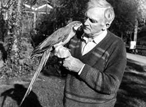 Images Dated 1st November 1989: Penscynor Wildlife Park owner Idris Hale holds a blue and gold macaw