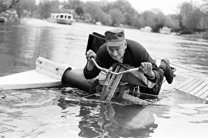 Experiment Prints: Pensioner Patrick Thomas pictured on his lying down bicycle equipped with floats as he