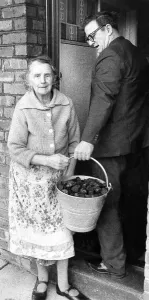 00101 Prints: This pensioner received her ration of coal during the fuel shortage in January 1972
