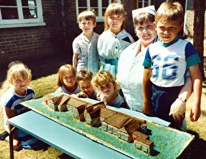 Cook Prints: Pentland Primary Schools cook Marian Whitehouse shows off her cake created to