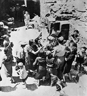 Air Force Prints: People of Catania, Sicily scramble for food given out by men of the Royal Air Force