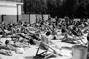People enjoying the hot weather at the Oasis outdoor swimming pool Lido, London